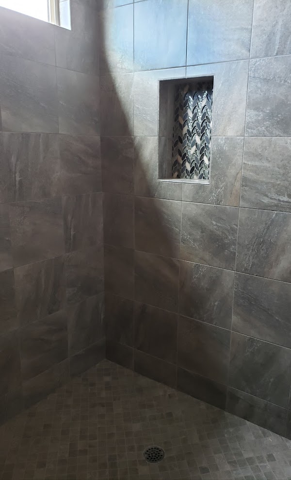 Tile shower surround installation in bathroom